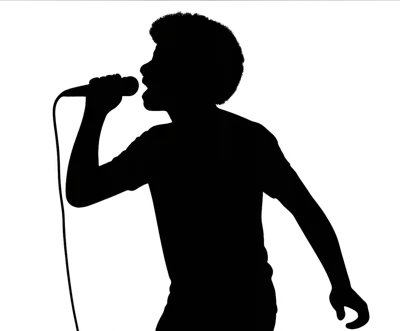Silhouette Of A Male Singer Performing With A Microphone