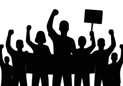 Silhouette Of A Diverse Crowd Protesting With Signs