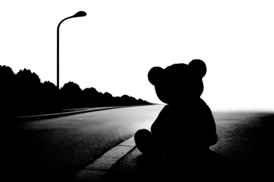 Silhouette Of A Lonely Teddy Bear On A Road
