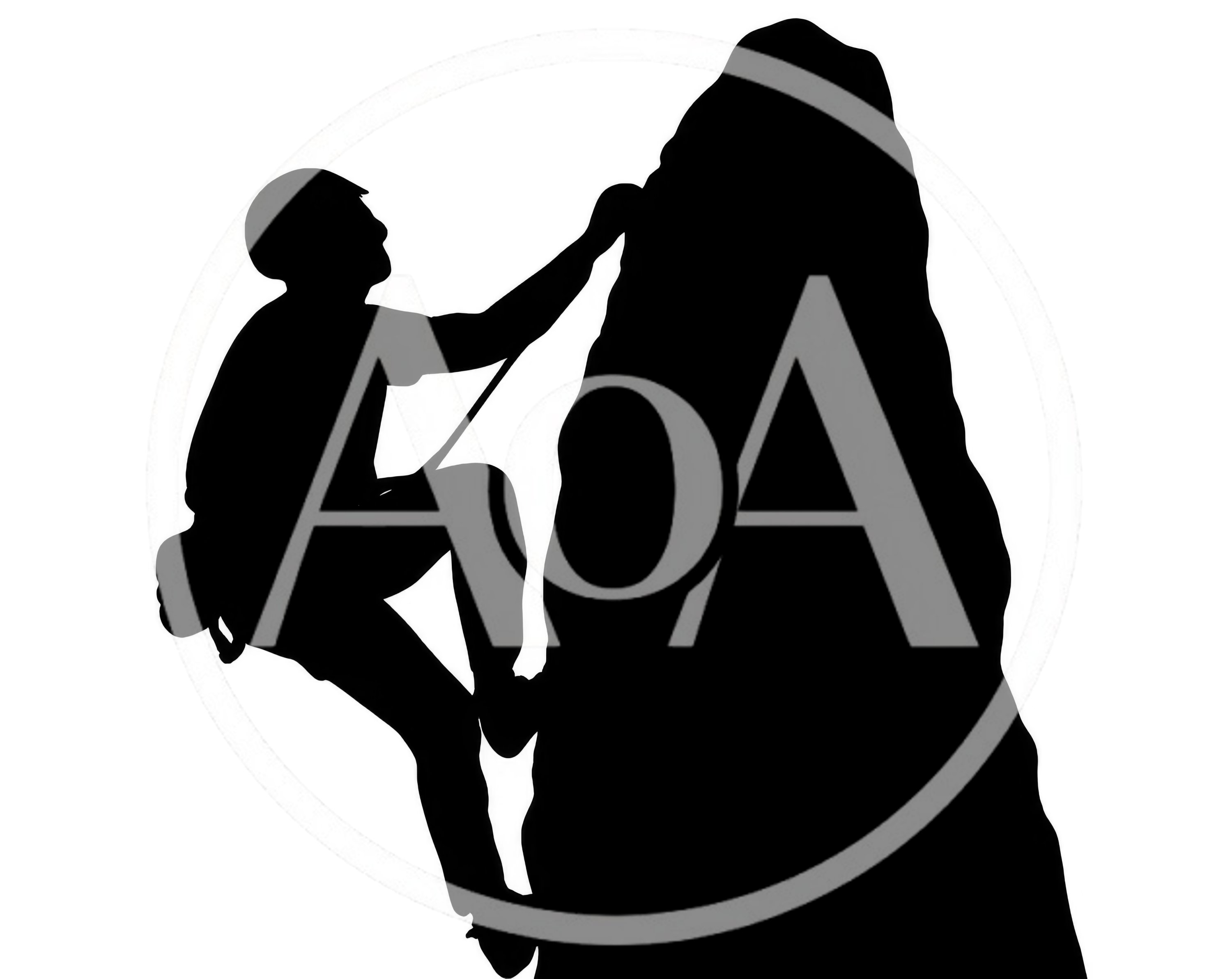 Silhouette Of A Rock Climber Scaling A Steep Cliff