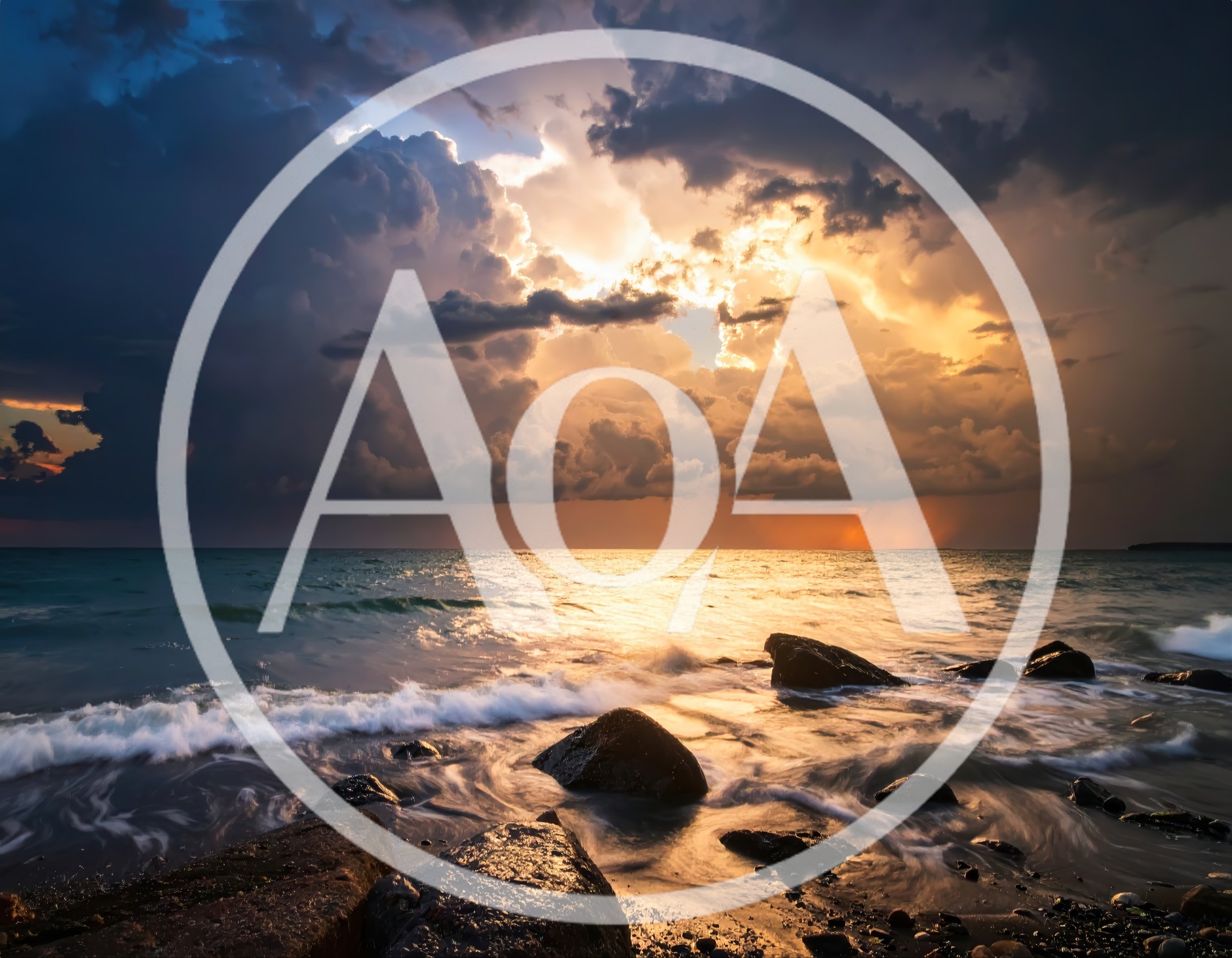 Dramatic Sunset Over Rocky Ocean Shoreline
