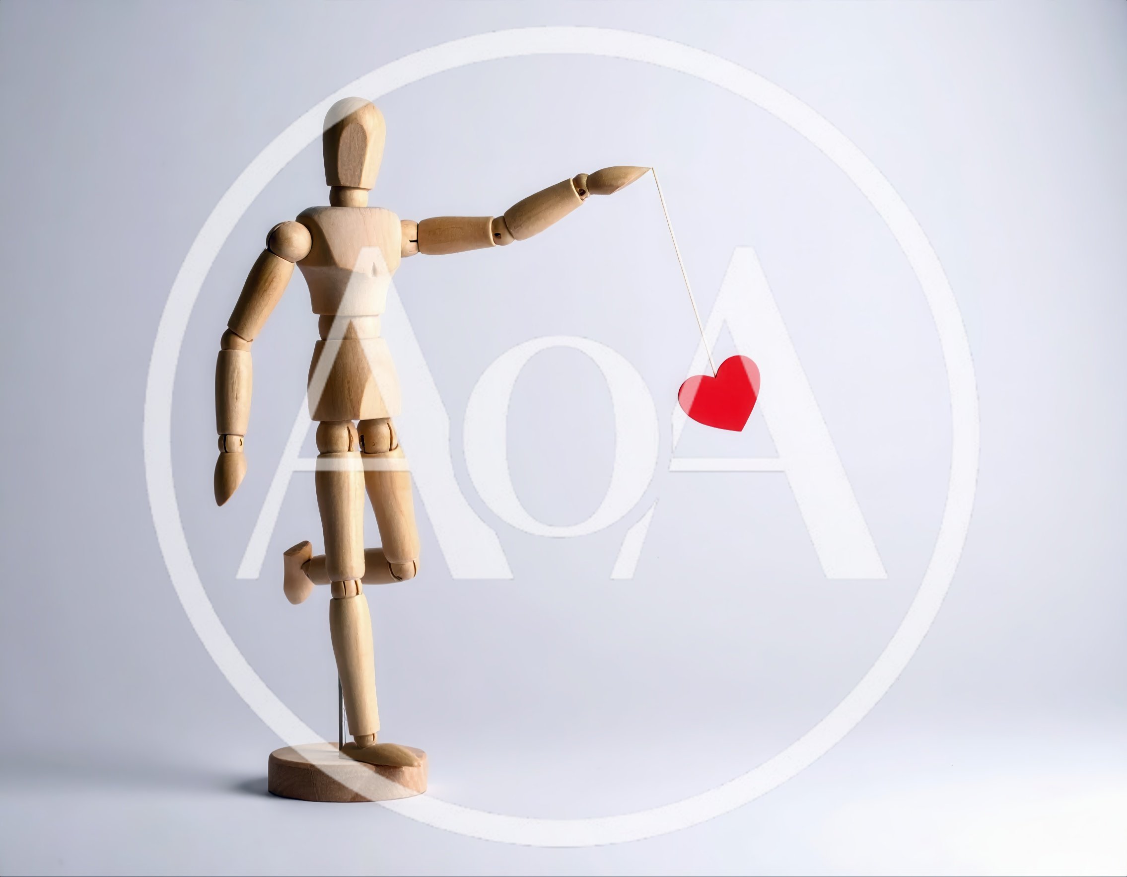 Wooden Mannequin Holding A Red Heart