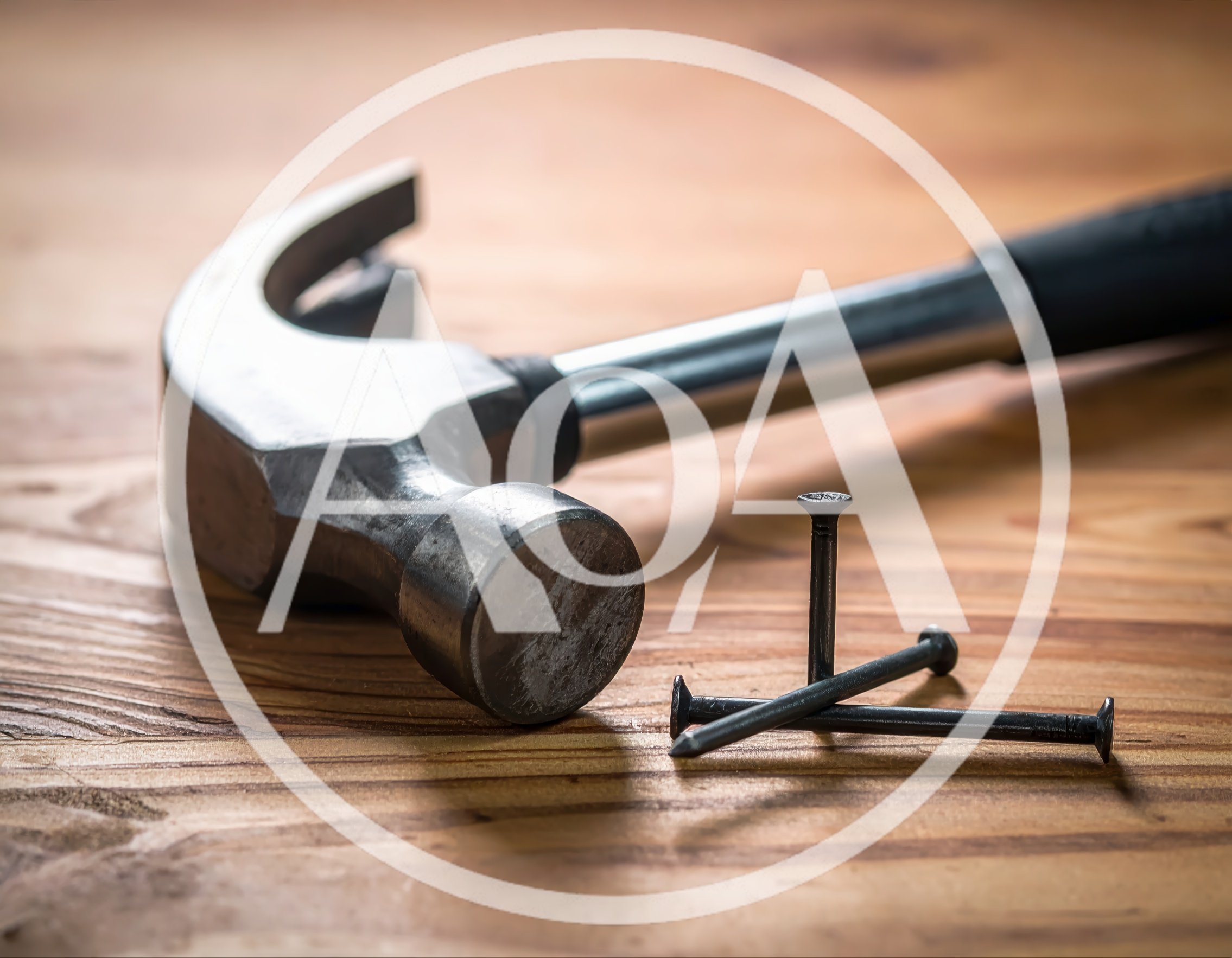 Claw Hammer And Three Nails On Wooden Surface