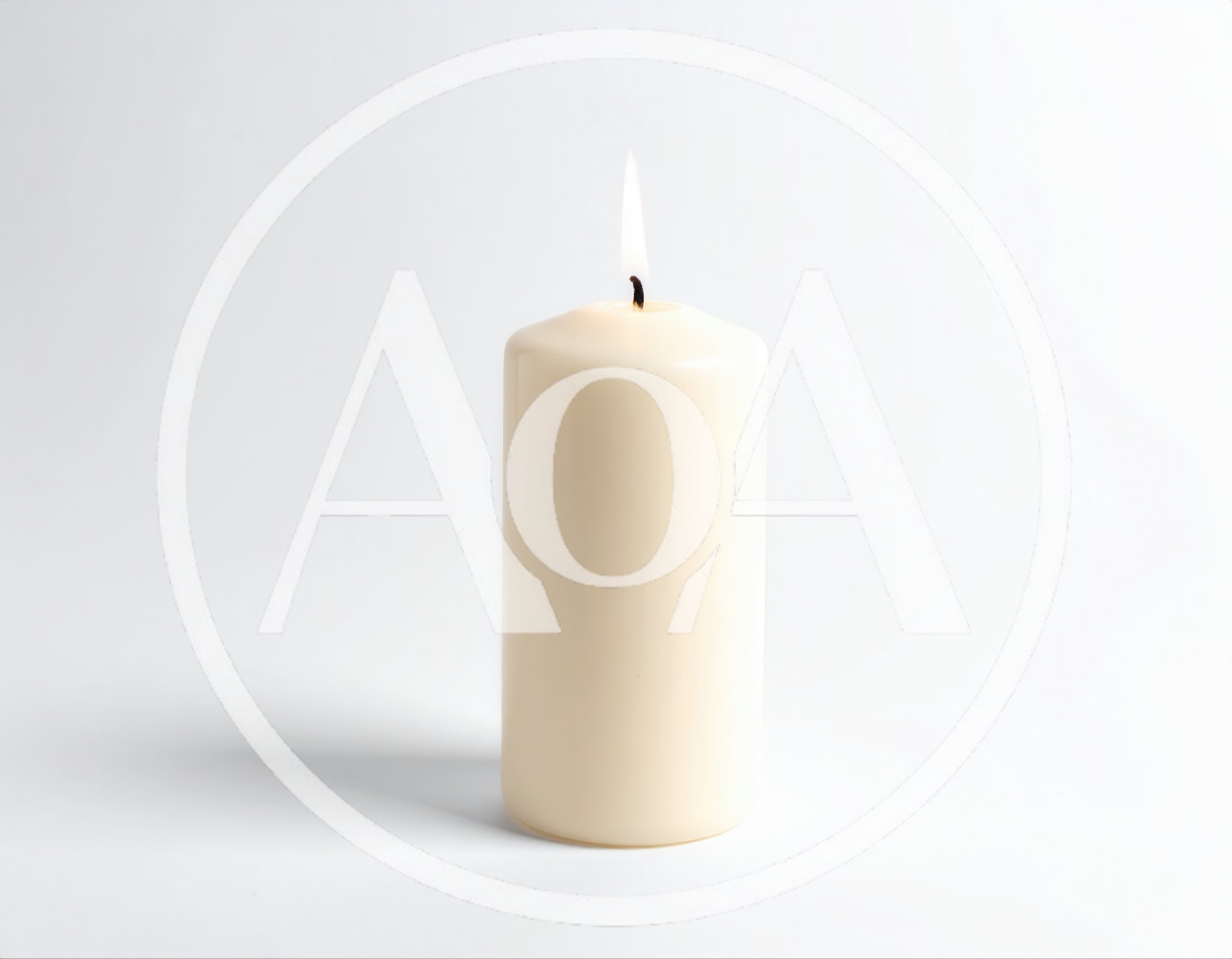 Lit Cream Pillar Candle On White Background