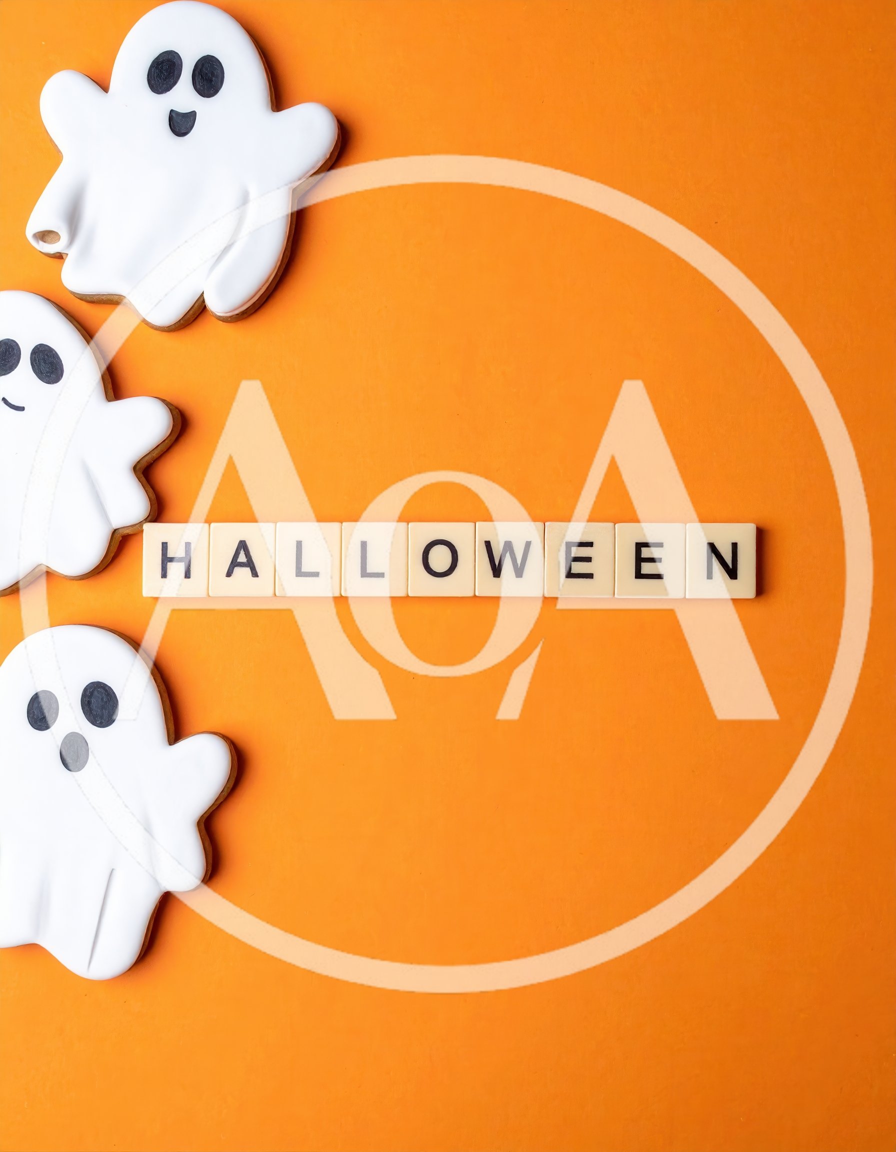 Halloween Cookies and Letter Tiles on Orange Background