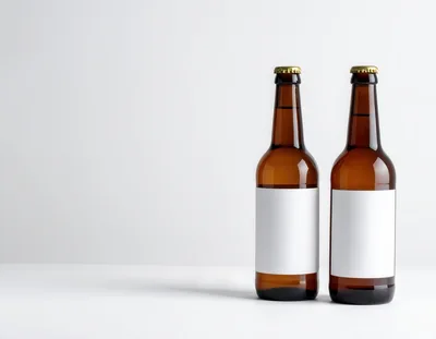 Two Brown Glass Beer Bottles With Blank Labels