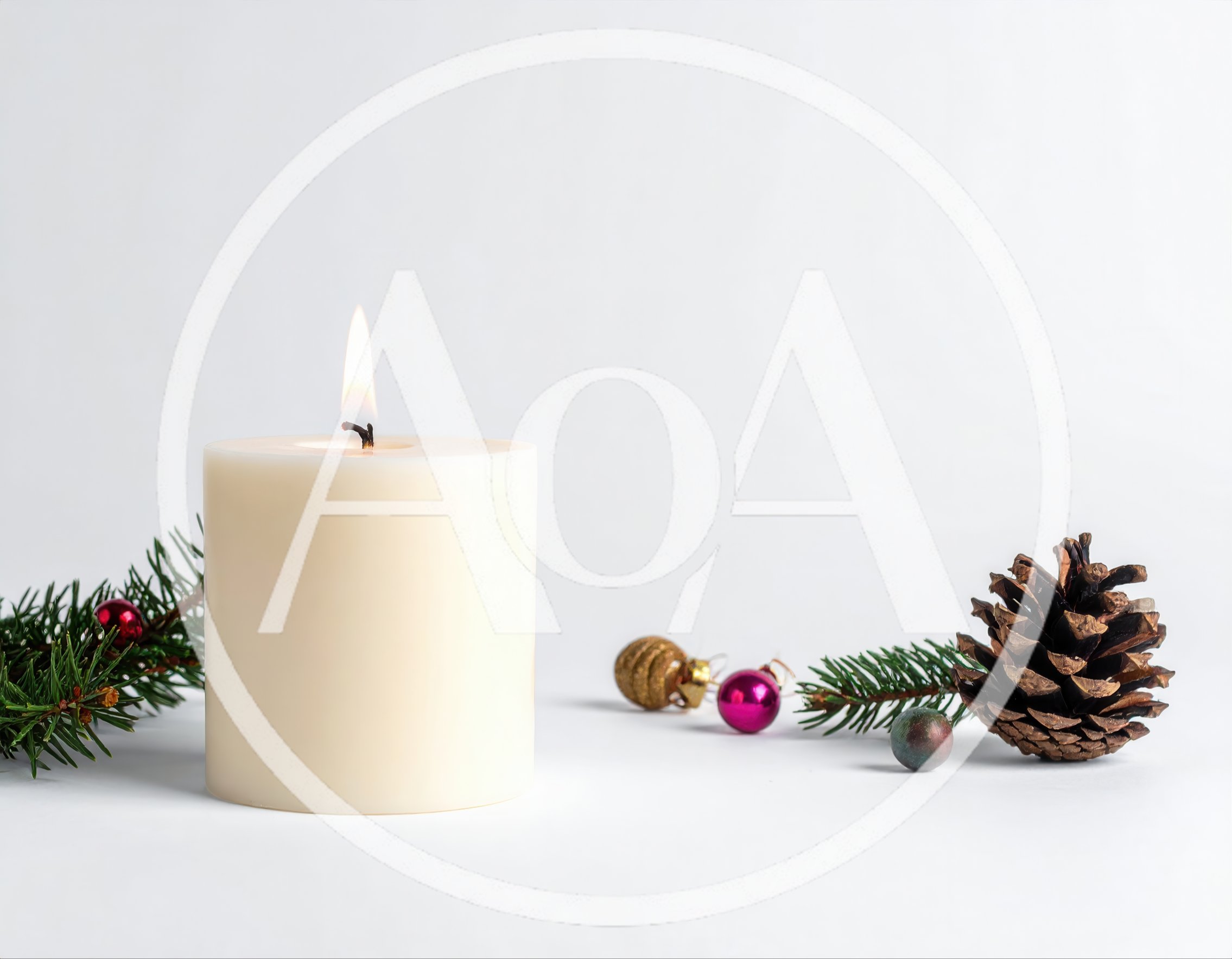 Lit Pillar Candle With Christmas Decorations