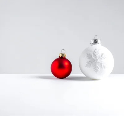 Red And White Christmas Ornaments On White Background