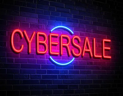 Neon Cyber Sale Sign on Dark Brick Wall