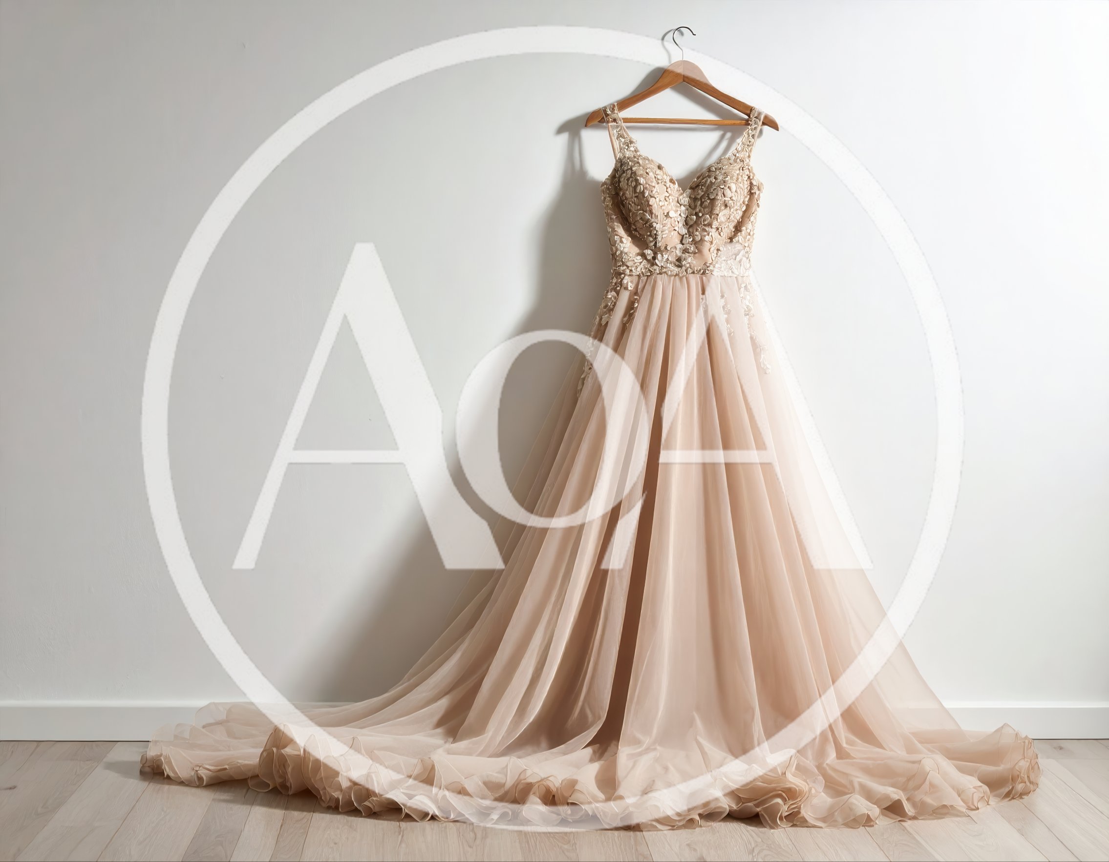 Elegant Beige Wedding Dress Hanging Against White Wall