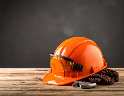 Construction Safety Equipment on Wooden Table