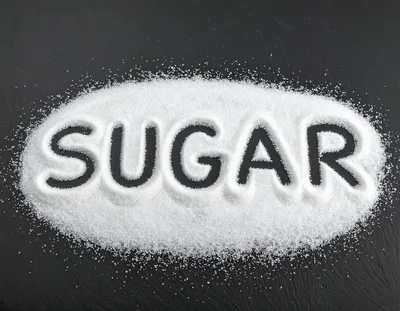 Sugar Word Written In White Granulated Sugar