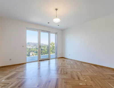 Empty Modern Room With Herringbone Wood Flooring