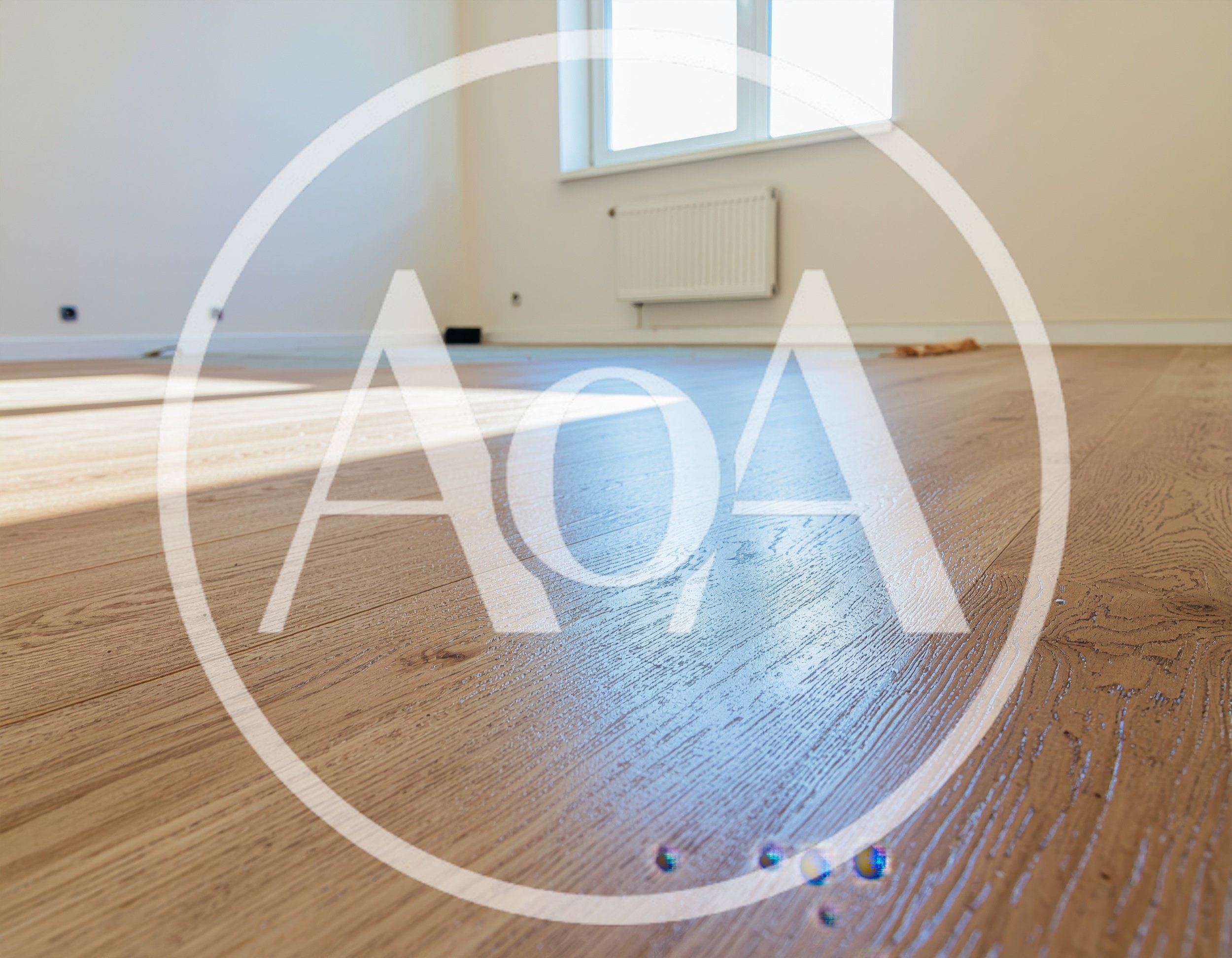 Newly Installed Light Oak Wood Flooring In Empty Room