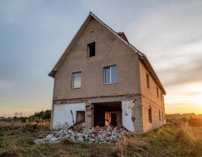 Abandoned Unfinished Brick House At Sunset