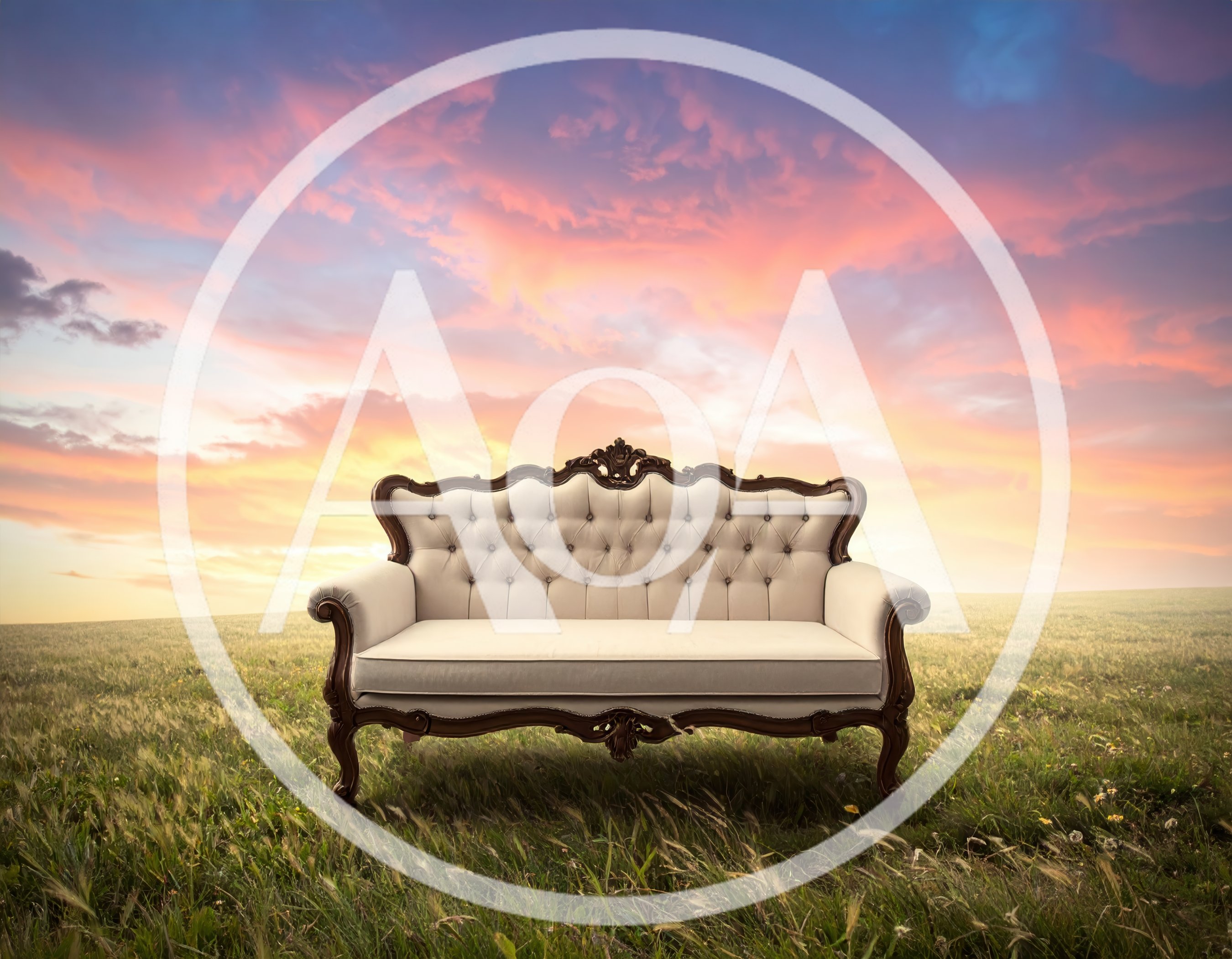 Vintage Tufted Sofa Sitting In A Grassy Field