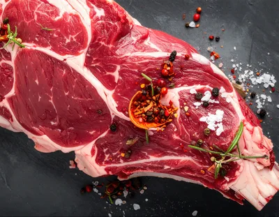Raw Ribeye Steak With Spices And Rosemary
