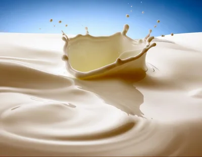 Milk Splash Crown Against Blue Sky Background