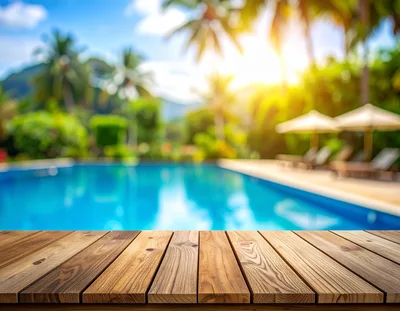 Wooden Table Surface Overlooking Tropical Resort Swimming Pool