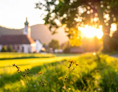 Golden Hour Sunset Over A Rural Village Church