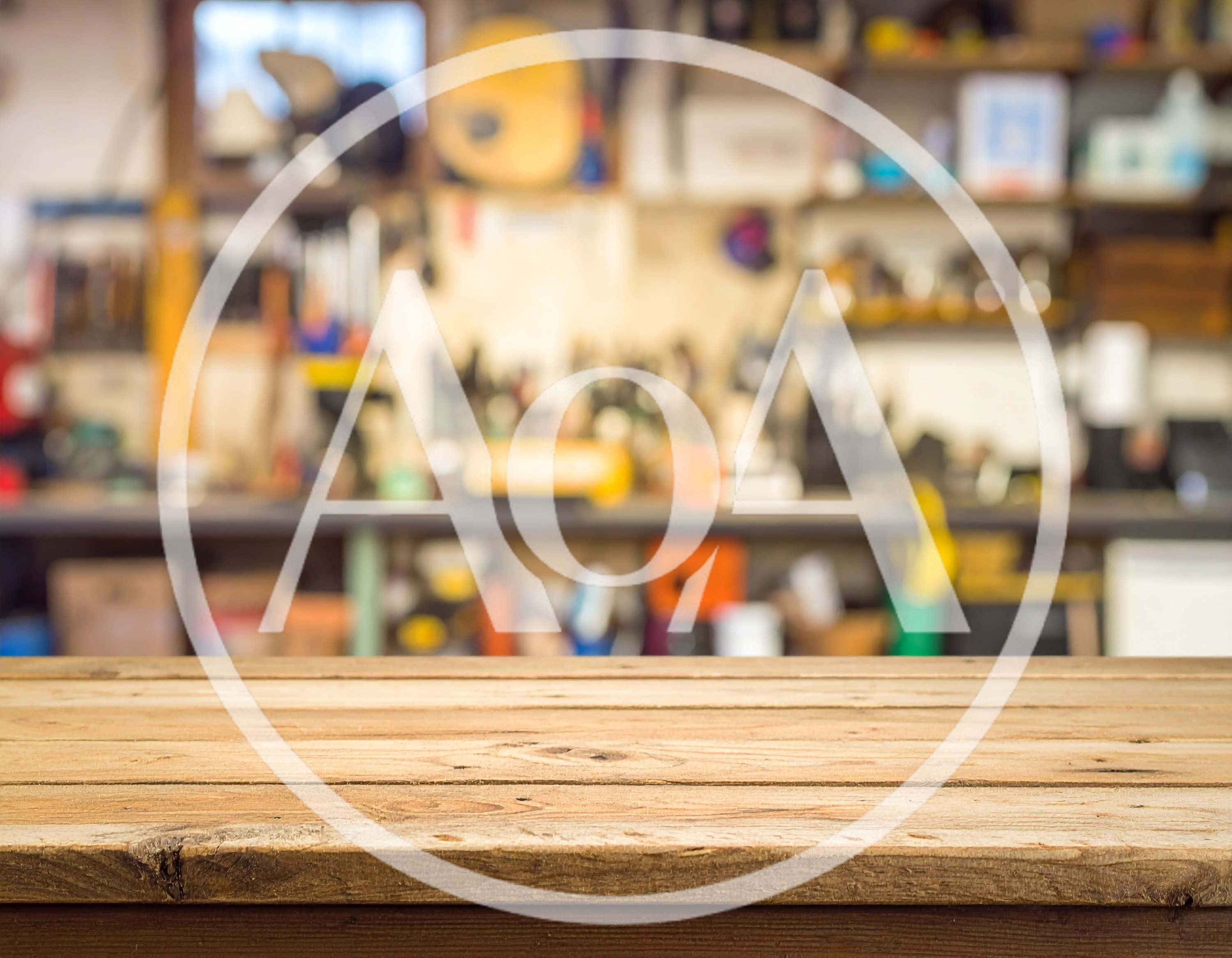 Wooden Table Surface In A Blurred Workshop Background