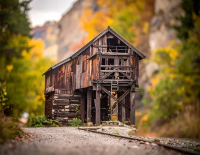 Abandoned Wooden Mining Structure In Autumn Forest