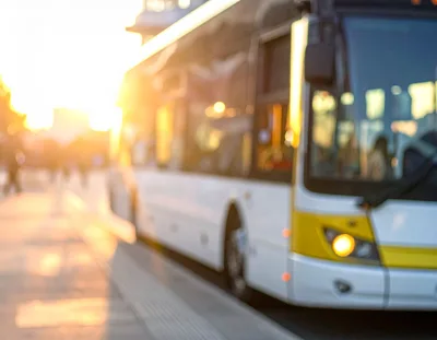 Modern Public Bus Arriving at City Stop