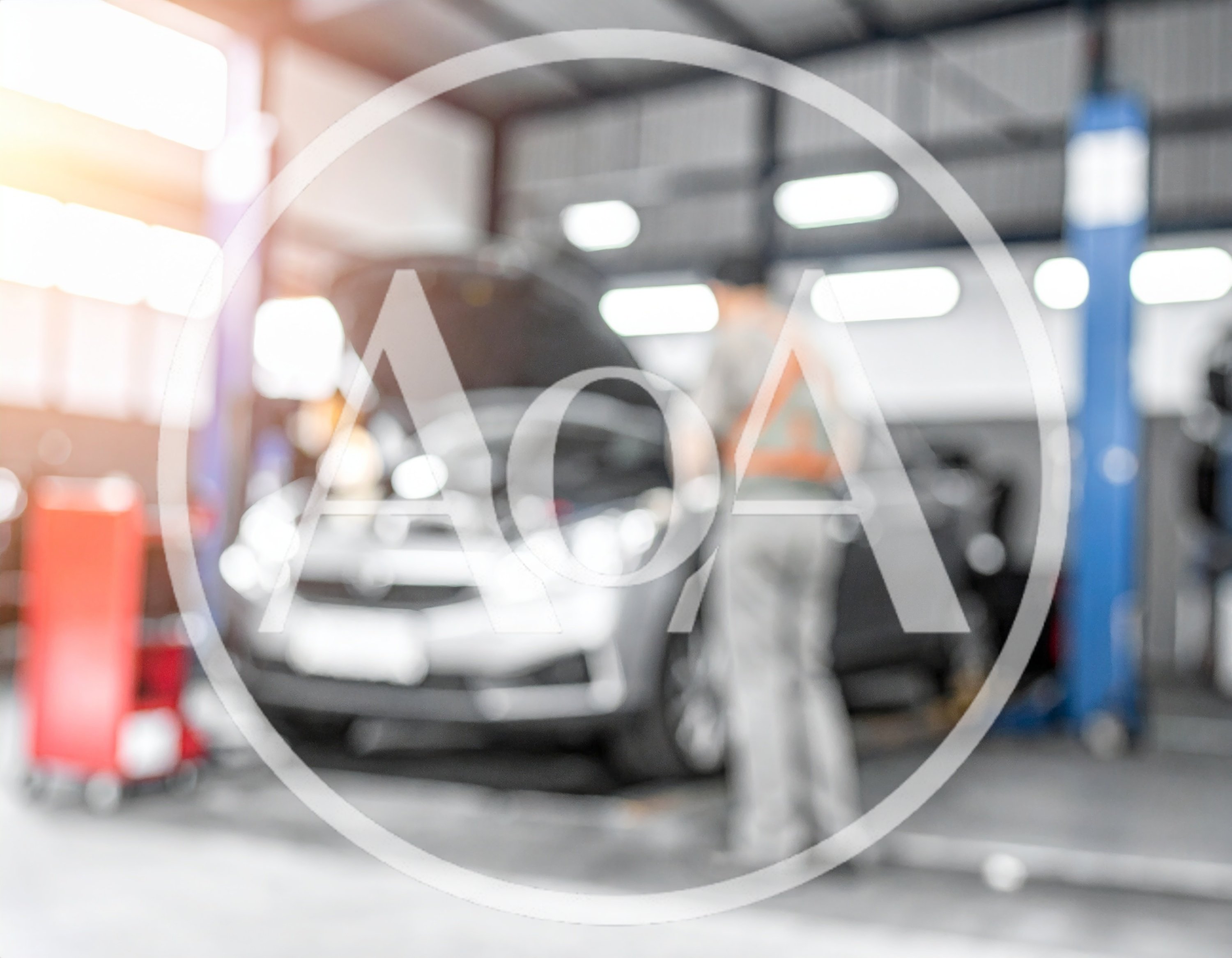 Mechanic Working on Car in Auto Repair Shop