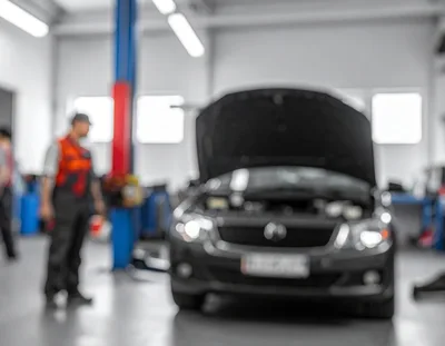 Mechanic Working In A Modern Car Repair Workshop