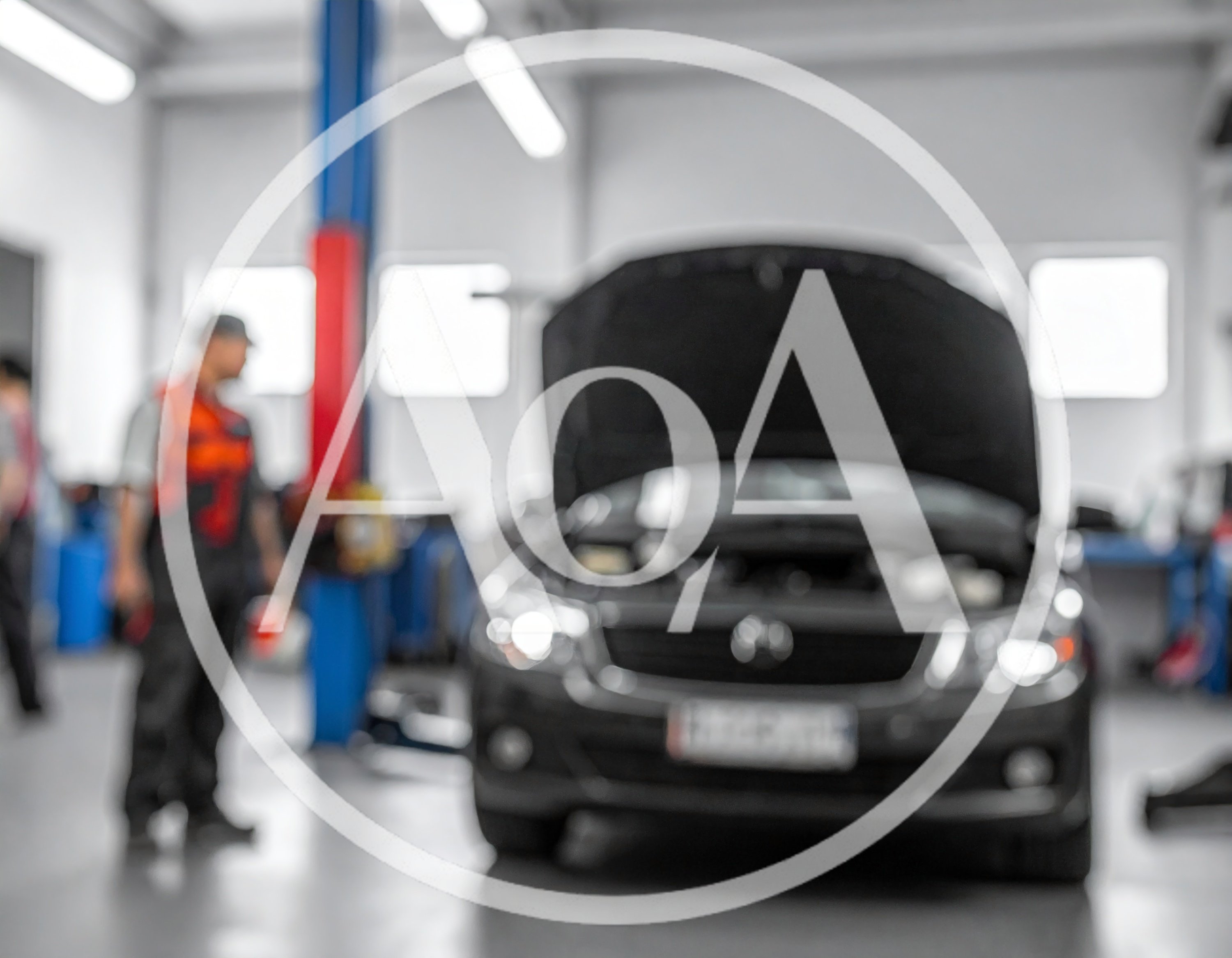Mechanic Working In A Modern Car Repair Workshop
