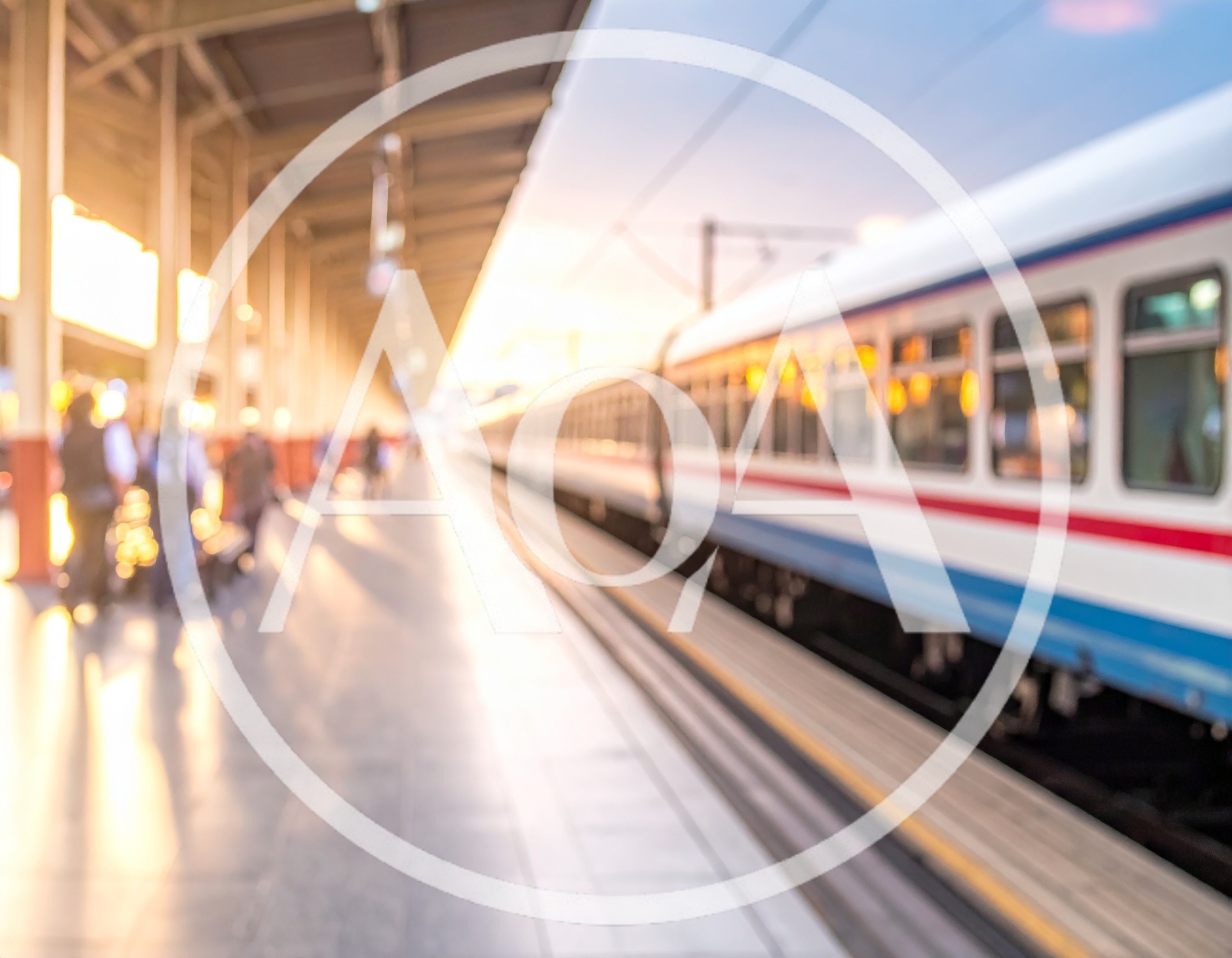Blurred Commuters Waiting At A Train Station Platform