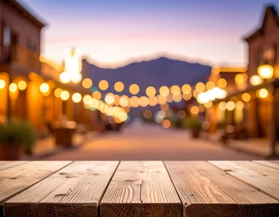 Wooden Table Surface Overlooking Blurred Western Town Street