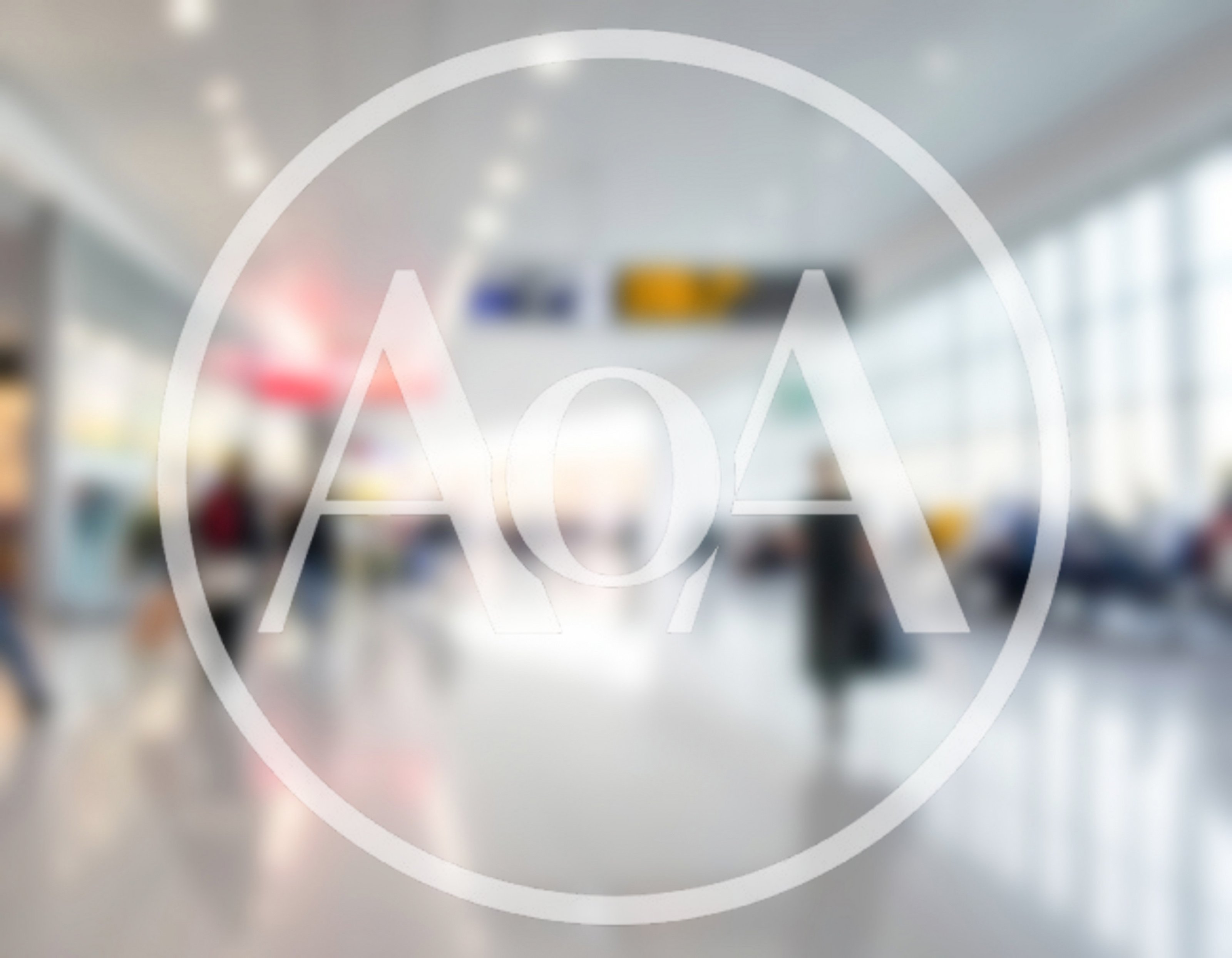 Blurred Passengers Walking Through A Modern Airport Terminal