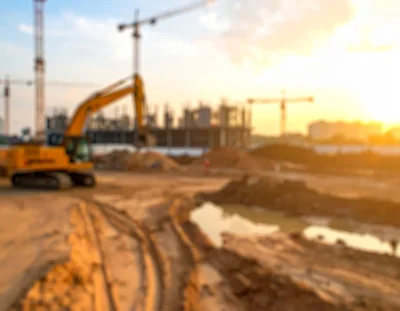 Yellow Excavator Working at a Construction Site