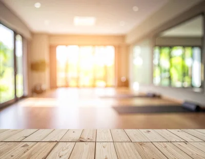 Wooden Table Surface Overlooking A Bright Yoga Studio