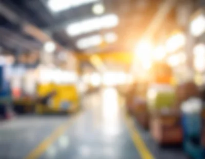 Blurred Industrial Warehouse Interior With Sunlight