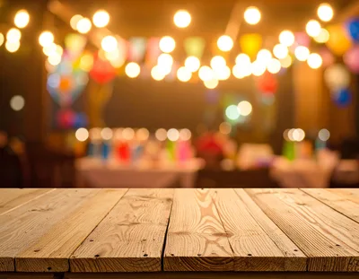 Empty Wooden Table With Blurred Party Background