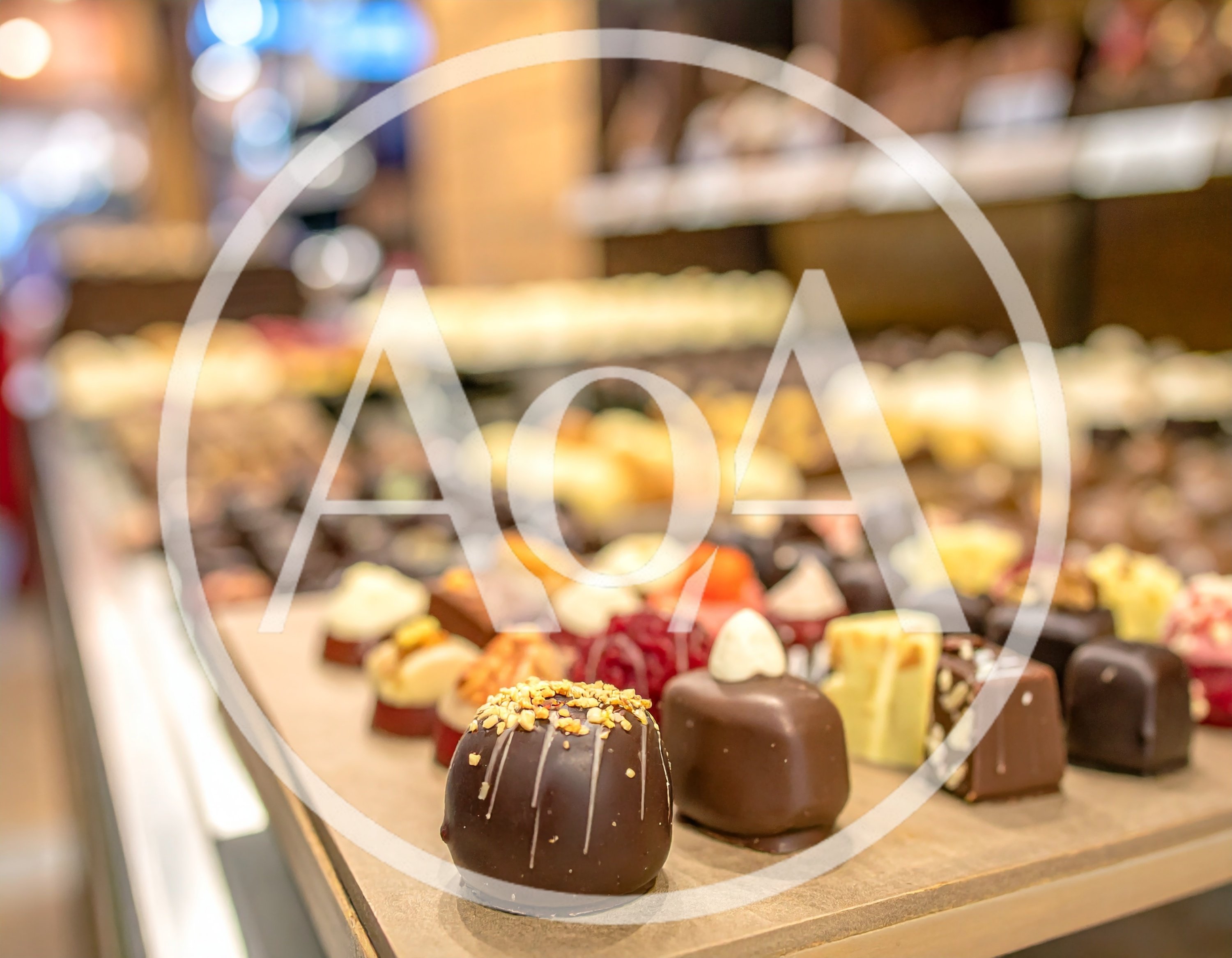 Assorted Gourmet Chocolates Displayed In A Confectionery Shop