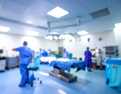 Medical Staff Preparing For Surgery In Operating Room