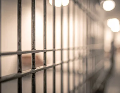 Close Up Of Prison Cell Bars In A Corridor