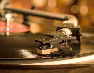 Close Up Of A Turntable Tonearm Playing Vinyl Record