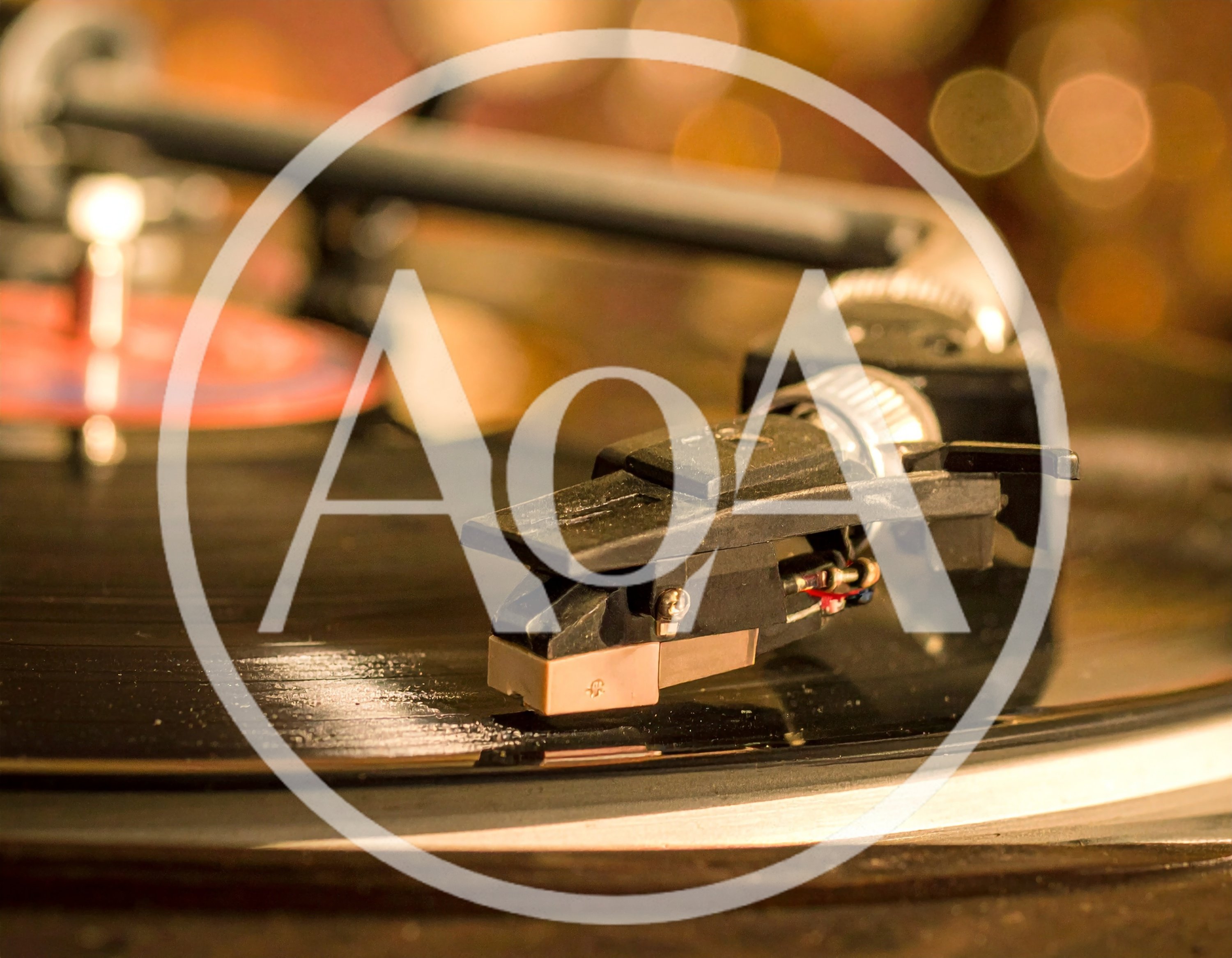 Close Up Of A Turntable Tonearm Playing Vinyl Record