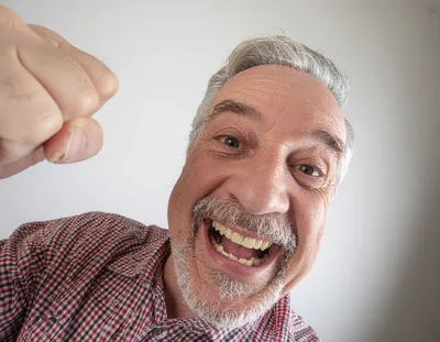 Excited Senior Man Making A Fist Gesture