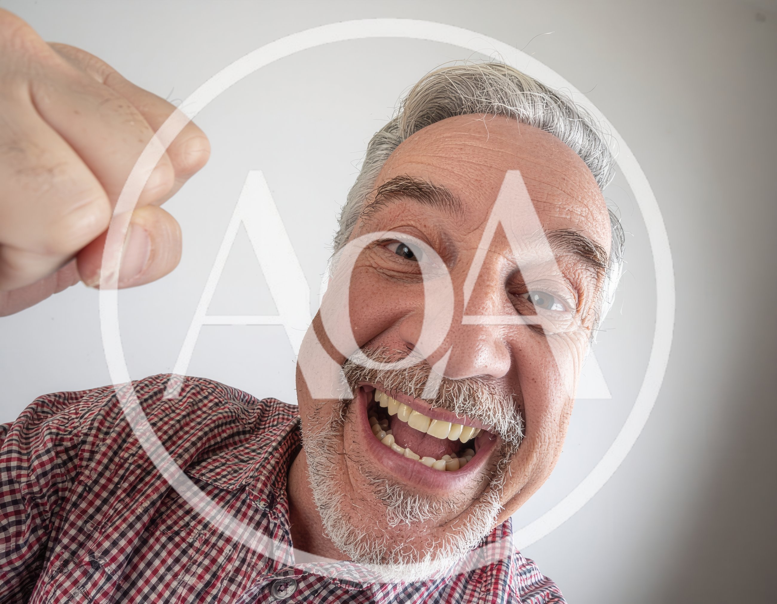 Excited Senior Man Making A Fist Gesture