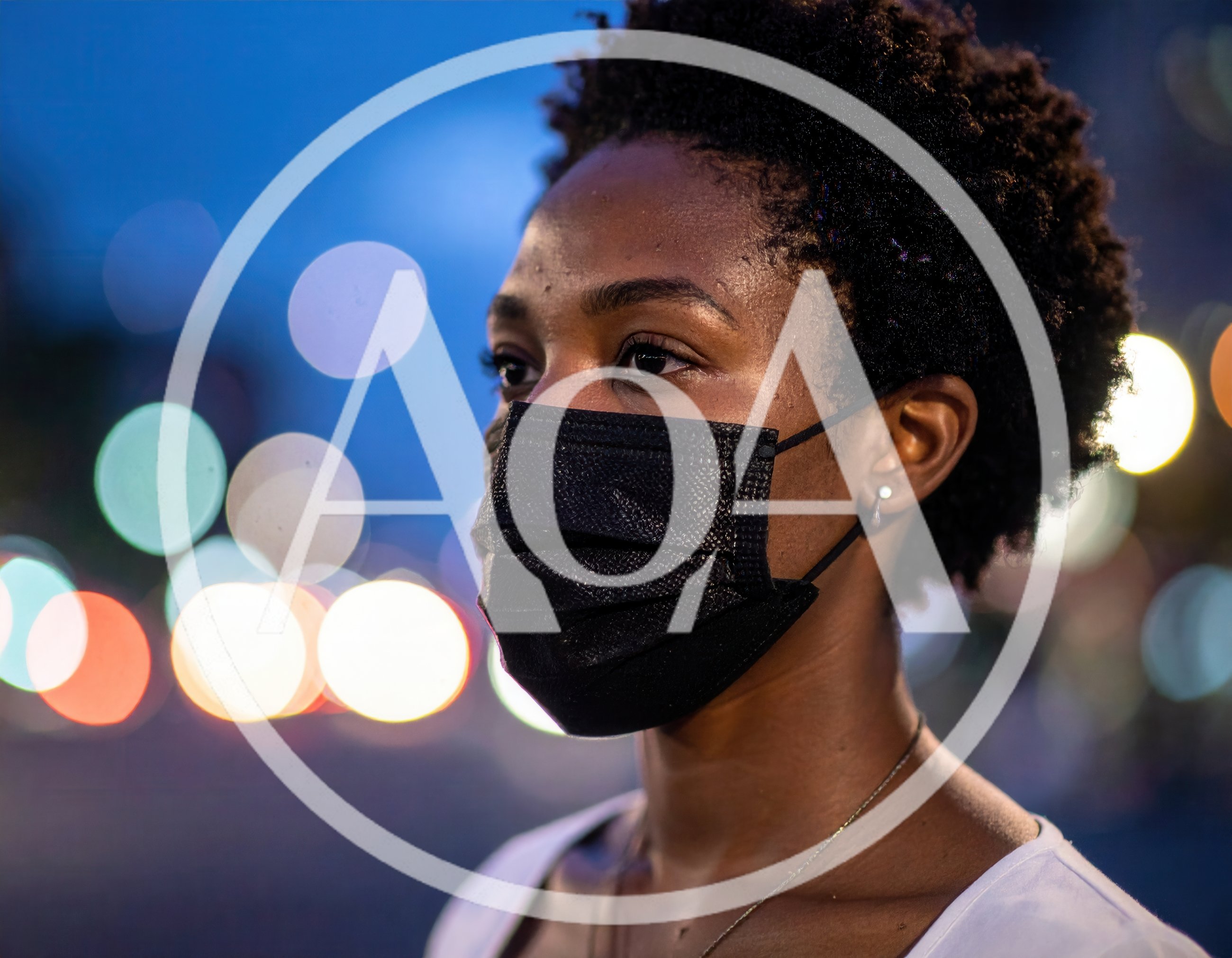 Young Woman Wearing A Black Face Mask Outdoors