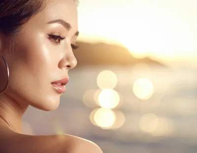 Close Up Portrait Of A Beautiful Woman At Sunset