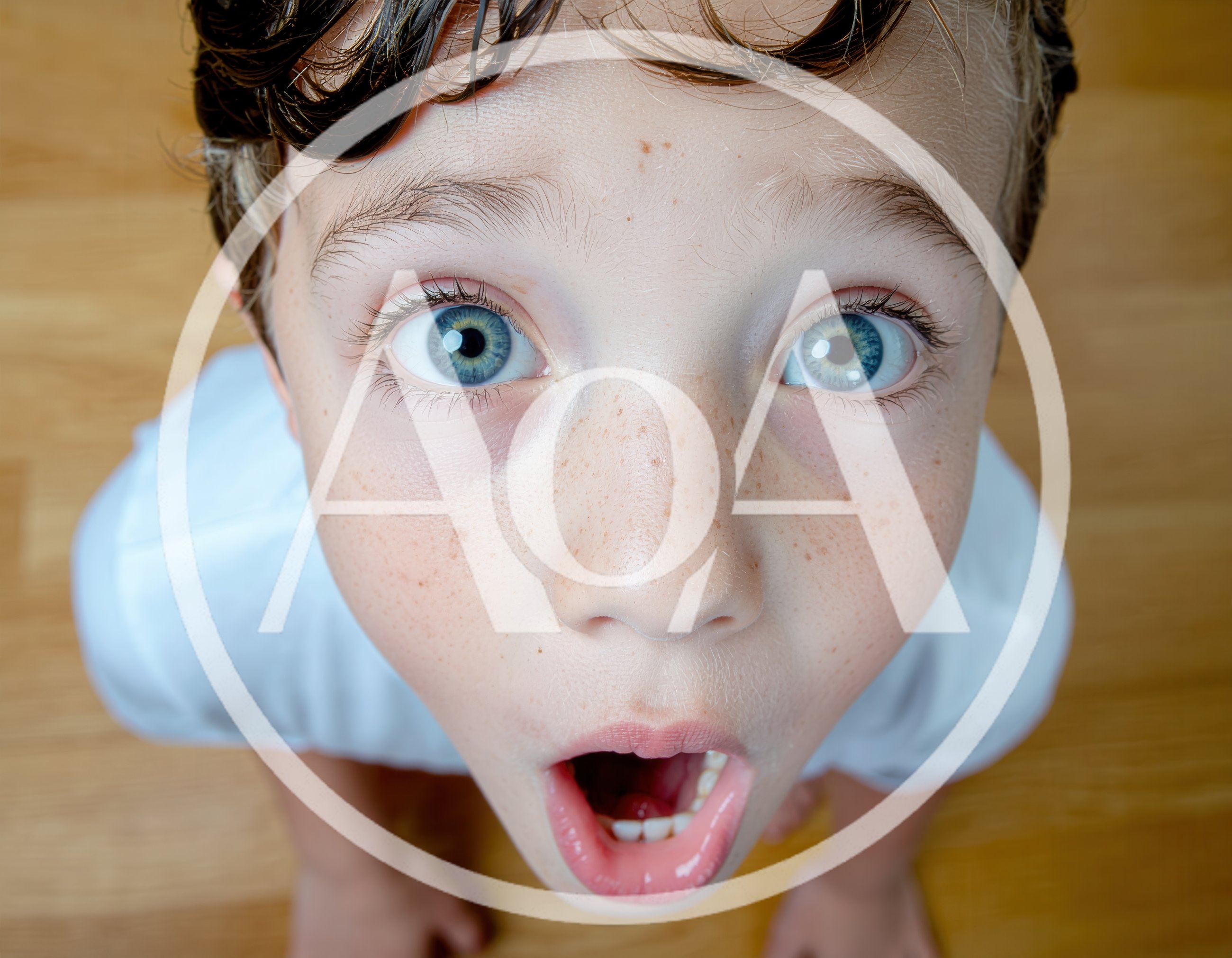Surprised Young Boy Looking Up With Wide Eyes