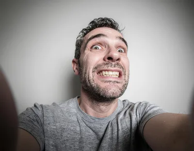 Man Making A Funny Grimacing Face Selfie