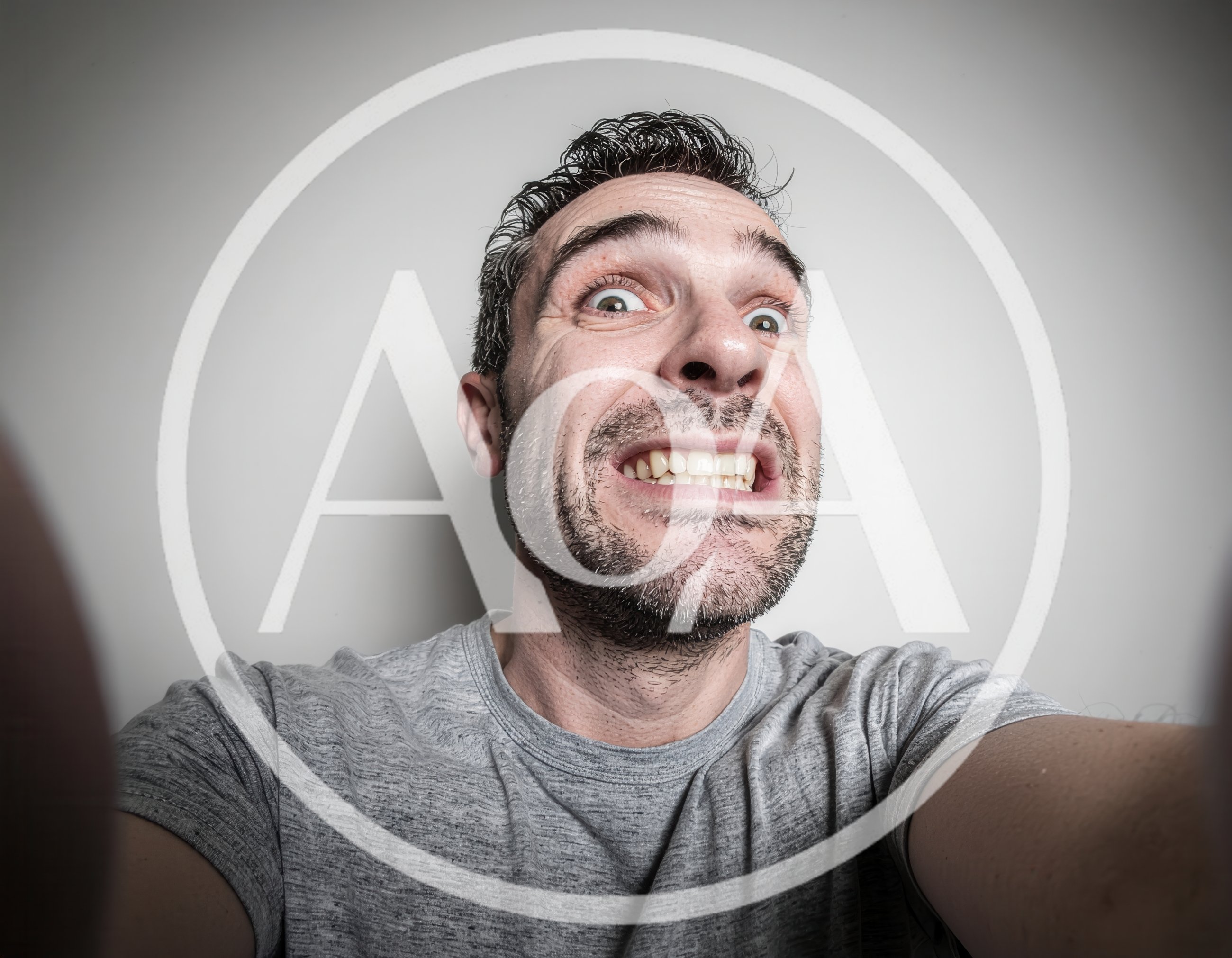 Man Making A Funny Grimacing Face Selfie
