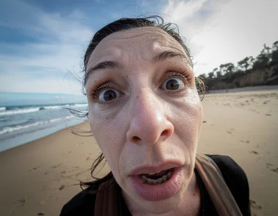 Woman Taking A Wide Angle Selfie On The Beach